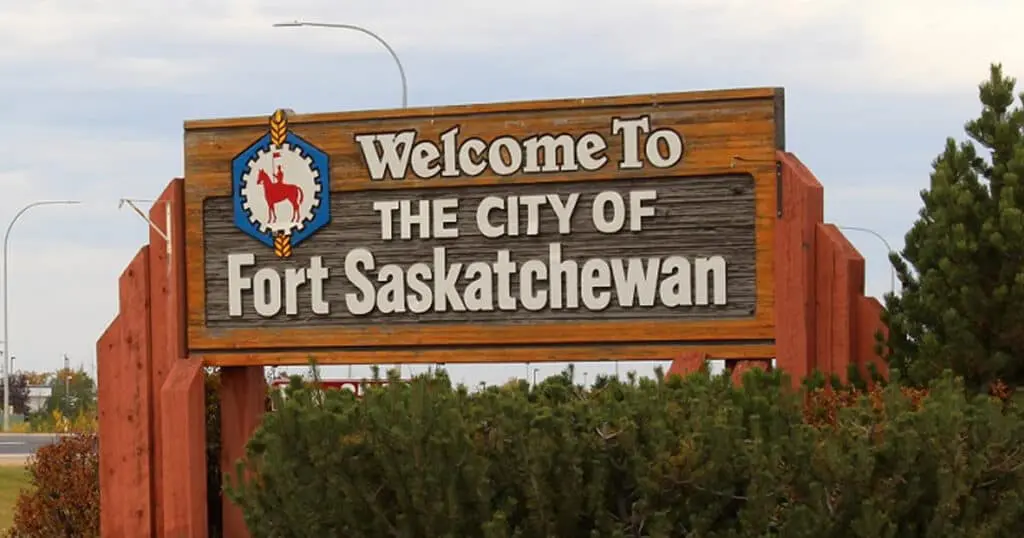 Welcome to Fort Saskatchewan city sign in Alberta, Canada, featuring the city emblem and welcoming message.