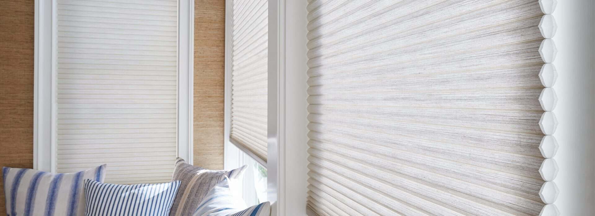 Soft beige window blinds enhancing natural light in modern home interior.