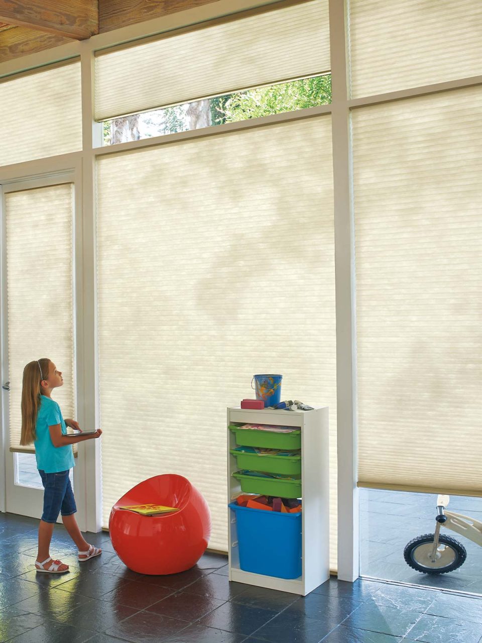 Child operating motorized blinds in Edmonton