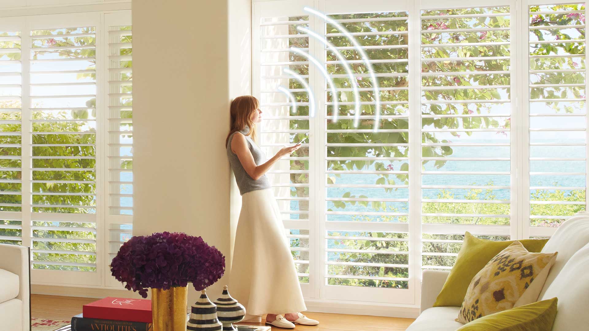 Woman operating PowerView Automation Voice Operated Blinds in Edmonton