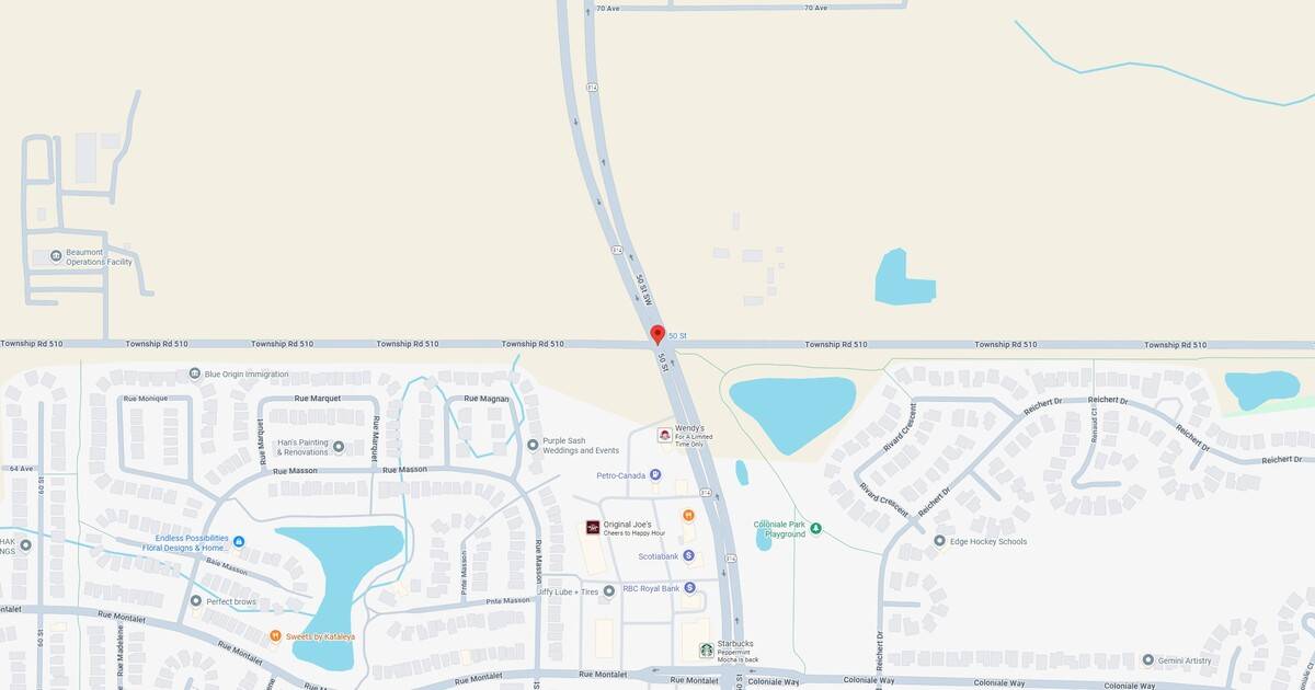 Empty map view of a suburban area with roads, lakes, and some businesses visible.