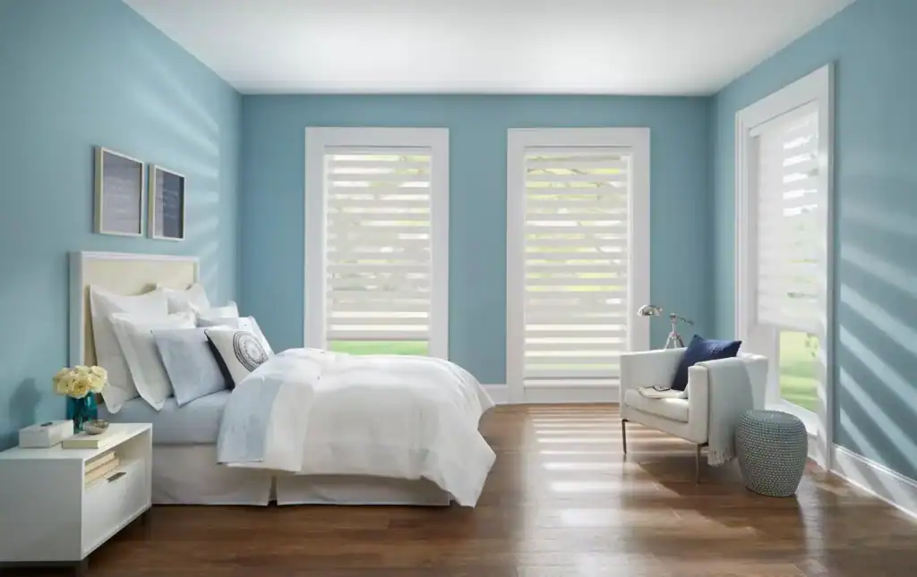 Bright, airy bedroom featuring ALTA Window Fashions shades providing privacy and style.