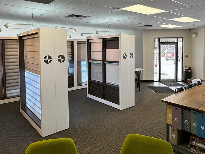 Modern retail shelving units with adjustable panels and lighting.
