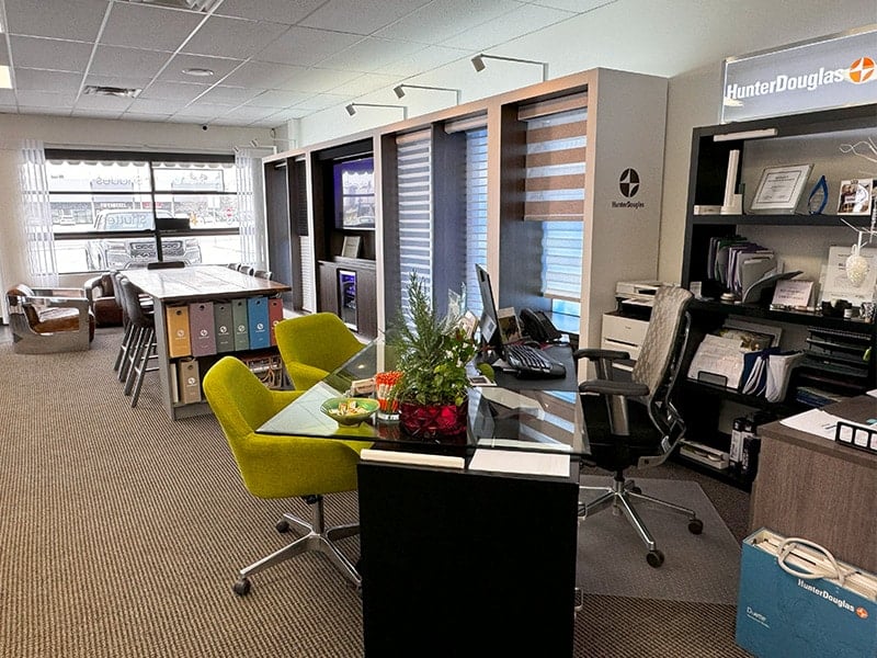 Bright, professional office environment with ergonomic furniture and organized workstations.