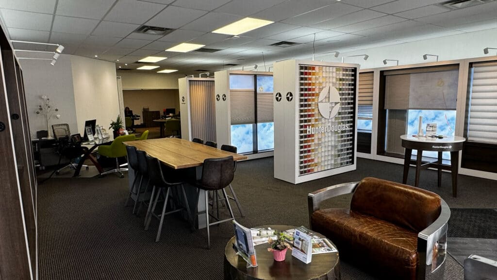 Office interior with meeting rooms, workstations, and natural light.